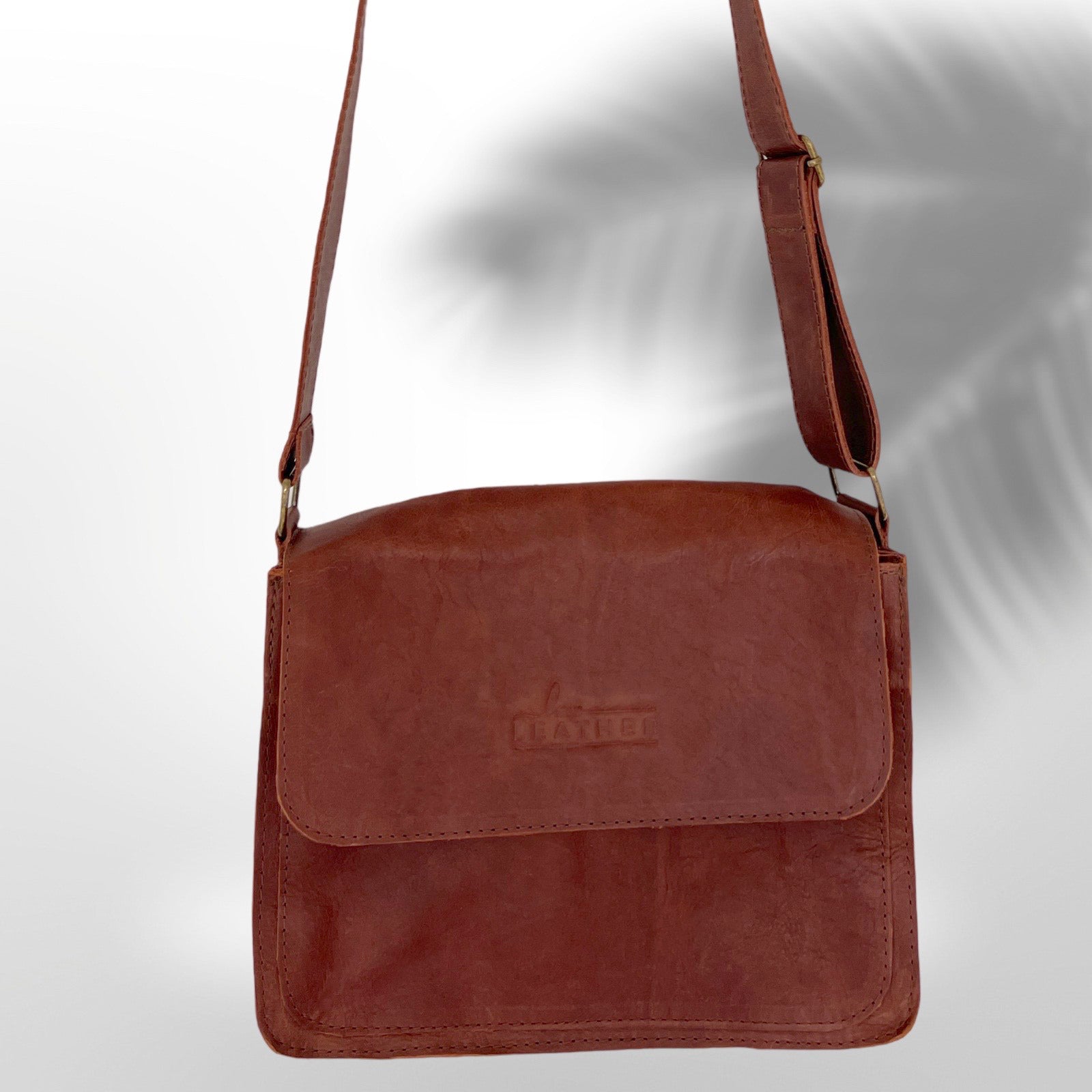 Postman style leather handbag in Urban Dark colour